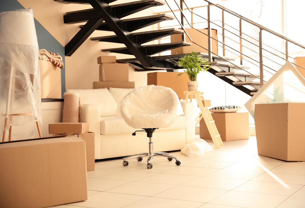 Different furniture at the foot of a stairs